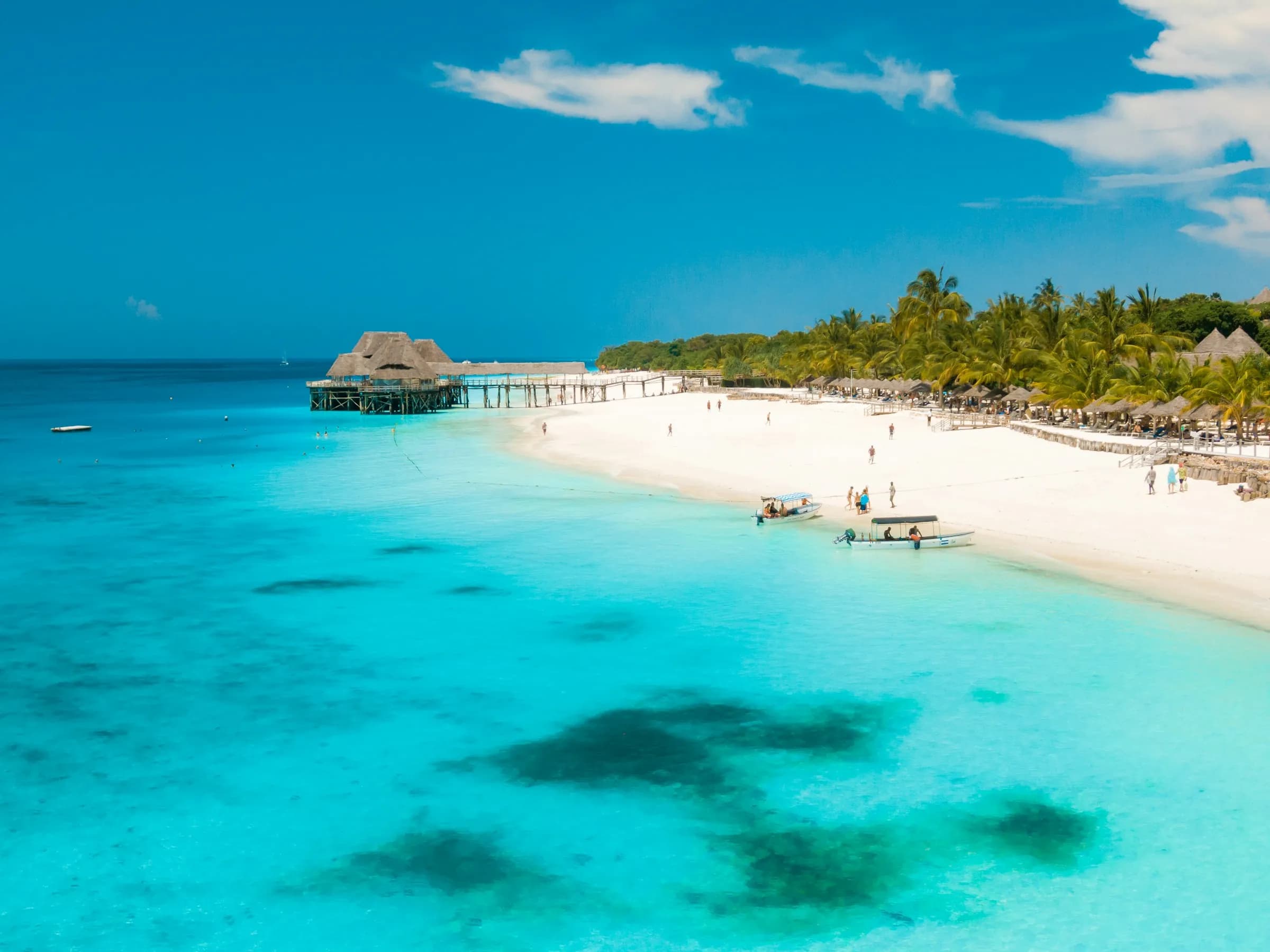 White-sand beach, palms and turquoise lagoon on the north-west coast of Zanzibar